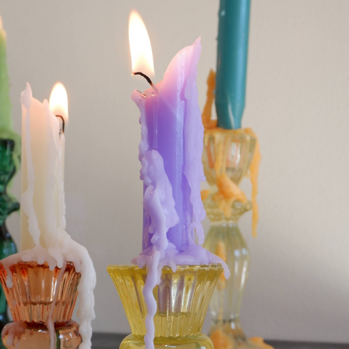 color drip candle on a wine bottle